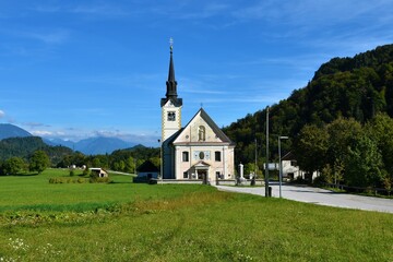 Fototapeta na wymiar View of parish Church of St . Margaret in Bohinjska Bela near Bled in Gorenjska region of Slovenia