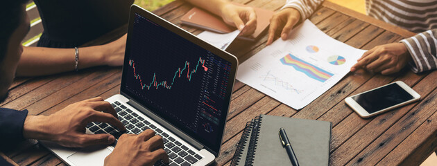 Stock market data chart analysis by ingenious computer software . Investment application display...