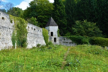 Old medieval defense wall with a small tower in the corner at Zicka kartuzija near Slovenske konjice, Slovenia