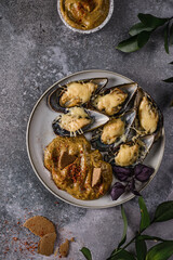 mussels baked in casings with cheese