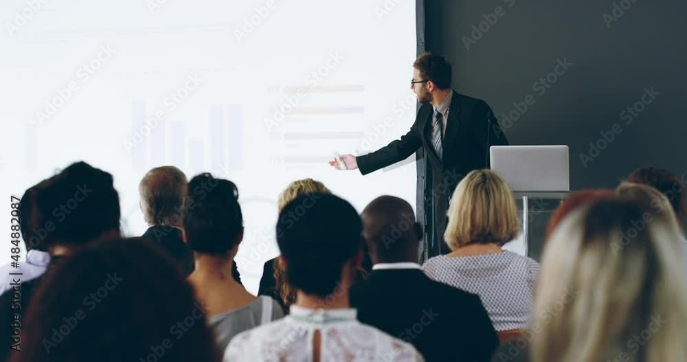 Poster killer presentations, how the pro does it. male business coach speaker in suit giving presentation. 