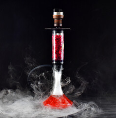hookah with ice and smoke on black background

