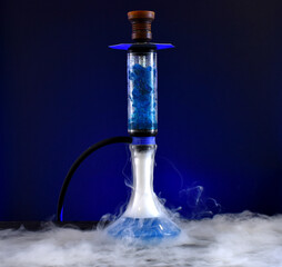 hookah with ice and smoke on black background
