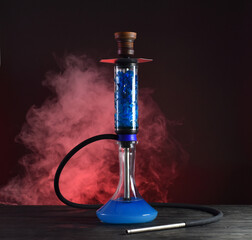 hookah with ice and smoke on black background
