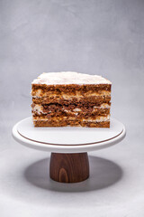 Homemade walnut cake in a section on a stand