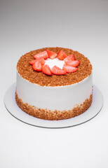 homemade honey cake decorated with strawberry slices
