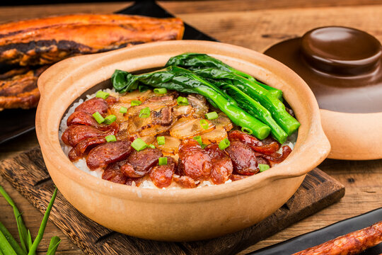 Cantonese style cooking of claypot rice with waxed meats