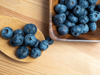Blueberries in a wooden bowl.