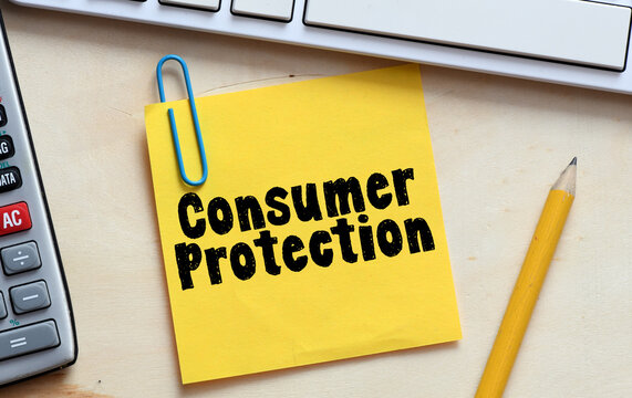 CONSUMER PROTECTION words on a yellow sheet of paper..