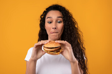 Funny Latin Lady Holding Burger At Studio