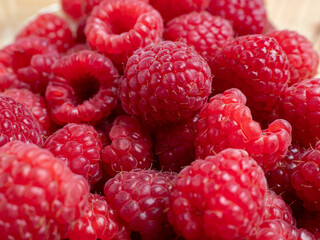 Raspberries in a wooden bowl.