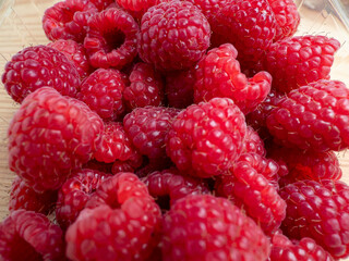 Raspberries in a wooden bowl.