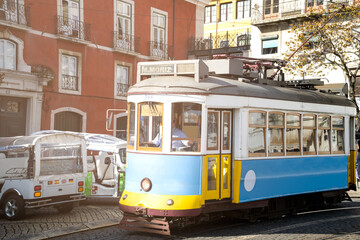 Naklejka na ściany i meble Typical lisbon tram with unrecognizable driver