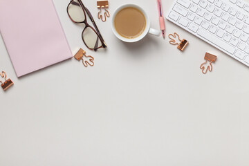 Desktop. Notepad keyboard cups of coffee glasses on the table. Top view flat lay copy space