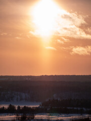 Beautiful winter forest in snow at sunset