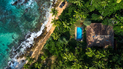 Aerial view of a villa with a swimming pool in the tropics. Hiriketiya beach, Sri Lanka. High...