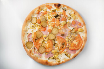 Italian pizza with tomato, cucumber and cheese. The process of making pizza. Street food cooking concept.