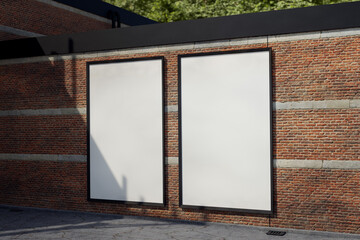 Blank Poster frame / Billboard / Display on an old factory brick wall - Mockup