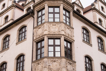 Obraz premium Munich, Germany - December 19 2021: Street view of The facade of the building in Munich downtown on Winter day.