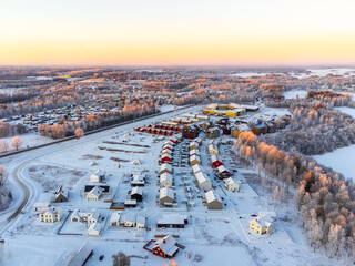 Aerial view of residential houses at winter. Scandinavian neighborhood, suburb.