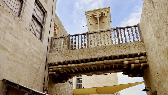 Revealing Wind Tower Behind Bridge On Houses In Al Fahidi Neighborhood In Dubai, United Arab Emirates. Pullback