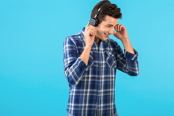 stylish young man listening to music on wireless headphones