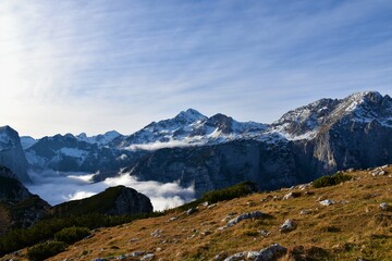 Fototapeta na wymiar Scenic view of mount Triglav in Julian alps, Slovenia and Krma valley bellow covered in fog