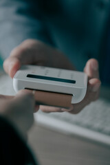 inserting a credit card into a payment terminal