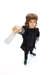 Portrait of liitle boy, kid in image of stylish hairdresser, barber isolated on white studio background. Concept of occupation, modern specialists, childhood