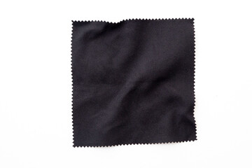 Black square piece of cloth, napkin isolated on white