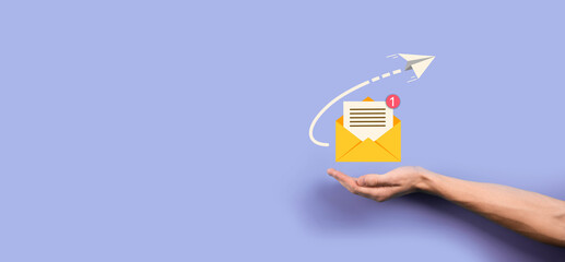 Businessman hand holding letter icon,email icons.Contact us by newsletter email and protect your personal information from spam mail.Customer service call center contact us.Email marketing newsletter. - obrazy, fototapety, plakaty