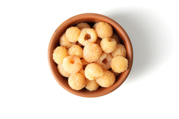 composition of ripe raspberries in a bowl on a textured background