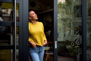 Cheerful happy satisfied smiling businesswoman or businessperson after a meeting. Adult person at...