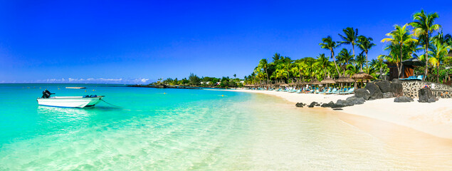 Idyllic tropical white sandy beaches with turquoise sea. Mauritius island holidays