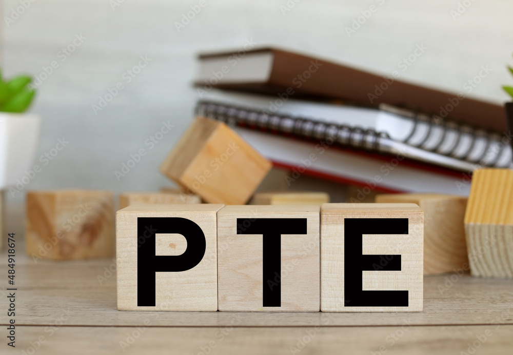 Poster pearson tests of english pte concept foreign language exams, text on wooden blocks on a working wood