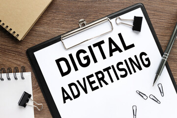Digital Advertising clip folder on table with place for text. business concept