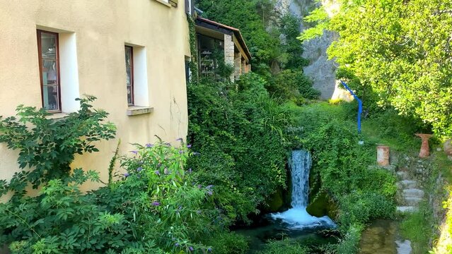 Waterfall of the Riou river in the old village of Moustiers Sainte Marie