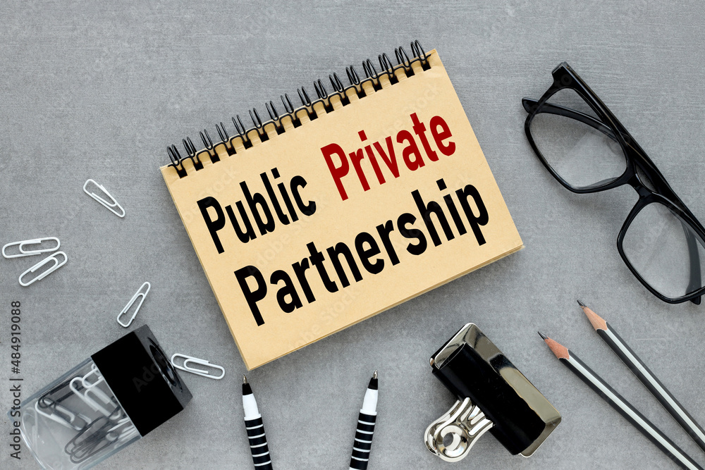 Poster ppp public-private partnership - open notepad with text on wooden background