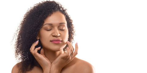 35 years old african-american woman with closed eyes touching her smooth clean skin - isolated on...