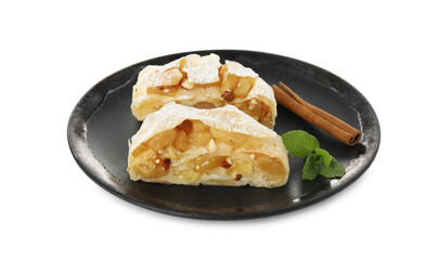 Pieces of delicious apple strudel with almonds, mint and cinnamon on white background