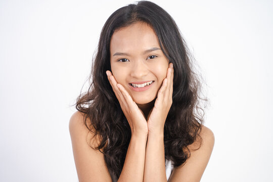asian woman with clean fresh skin on white background