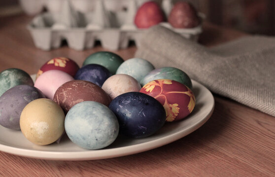 colorful naturally dyed Easter eggs background egg carton
