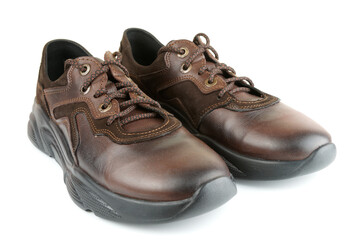 Brown leather walking shoes on white