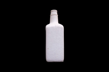 white bottle of gypsum isolated on a black background