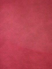 Fototapeta premium Burgundy suede surface textured as a background. High quality photo