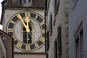 Fototapeta na wymiar Protestant clock tower of church St. Peter with gray sky background on a winter day. Photo taken February 1st, 2022, Zurich, Switzerland.