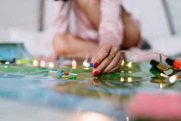 Girl pointing with notice board pins on Russia map