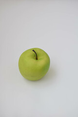Moscow, Russia, February 2022, green apple on a white background