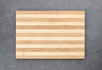Empty wooden board over stone background with copy space