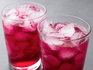 Grape soda, soft drink in cups with ice
